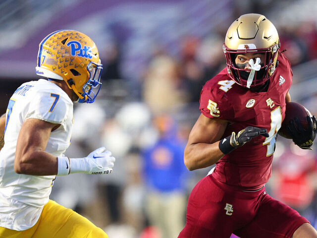 CHESTNUT HILL, MA - NOVEMBER 30: Boston College Eagles wide receiver Reed Harris (4) runs with the ball after a catch pursued by Pittsburgh Panthers defensive back Javon McIntyre (7) during the college football game between Pittsburgh Panthers and Boston College Eagles on November 30, 2024, at Alumni Stadium in Chestnut Hill, MA.