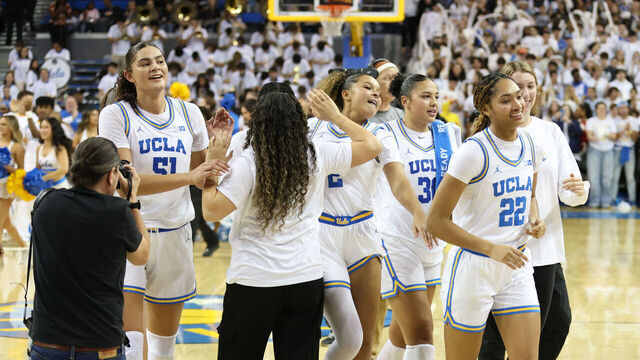 LOS ANGELES, CALIFORNIA - NOVEMBER 24: Kendall Dudley #22 of the UCLA Bruins celebrate a 77-62 win against the South Carolina Gamecocks with her team at UCLA Pauley Pavilion on November 24, 2024 in Los Angeles, California.