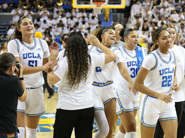 LOS ANGELES, CALIFORNIA - NOVEMBER 24: Kendall Dudley #22 of the UCLA Bruins celebrate a 77-62 win against the South Carolina Gamecocks with her team at UCLA Pauley Pavilion on November 24, 2024 in Los Angeles, California.