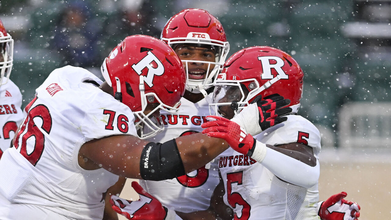 EAST LANSING, MI - NOVEMBER 30: Rutgers Scarlet Knights running back Kyle Monangai (5) celebrates a first quarter touchdown with his teammates during a college football game between the Michigan State Spartans and Rutgers Scarlet Knights on November 30, 2024 at the Breslin Center in East Lansing, MI.