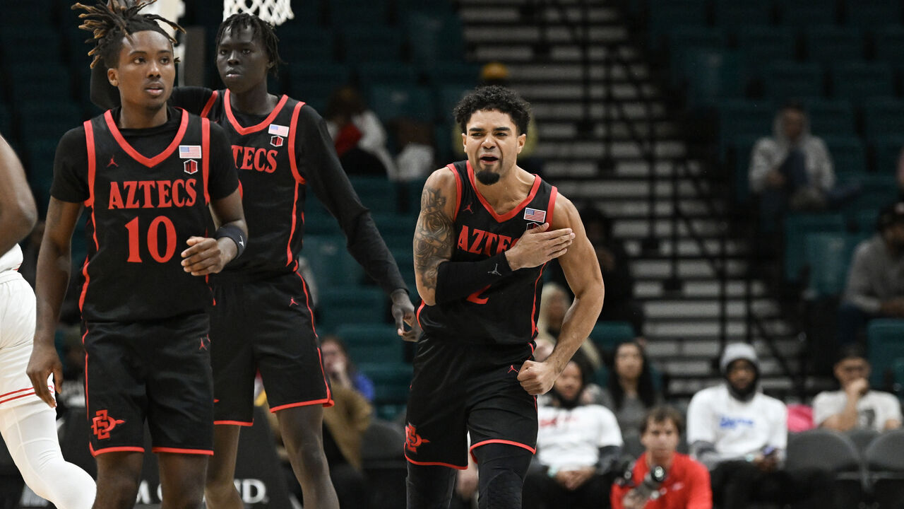 LAS VEGAS, NEVADA - NOVEMBER 30: Nick Boyd #2 of the San Diego State Aztecs reacts to scoring on the Houston Cougars in the second half of their game during the Players Era Festival basketball tournament at MGM Grand Garden Arena on November 30, 2024 in Las Vegas, Nevada. The Aztecs defeated the Cougars 73-70 in overtime.