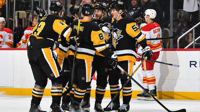 PITTSBURGH, PA - NOVEMBER 30: Kris Letang #58 of the Pittsburgh Penguins celebrates his goal with teammates during the third period against the Calgary Flames at PPG PAINTS Arena on November 30, 2024 in Pittsburgh, Pennsylvania.