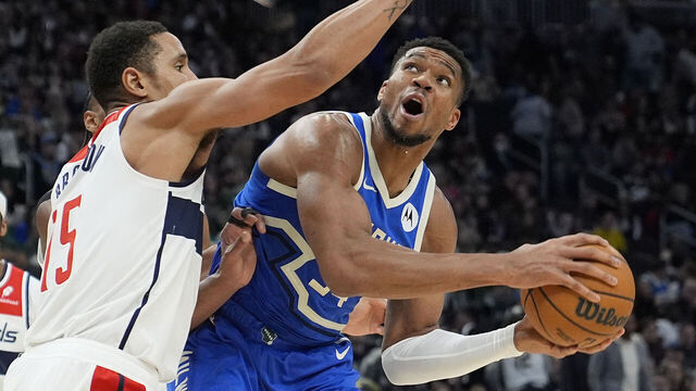 MILWAUKEE, WISCONSIN - NOVEMBER 30: Giannis Antetokounmpo #34 of the Milwaukee Bucks goes to the basket against Malcolm Brogdon #15 of the Washington Wizards during the second quarter of a game at Fiserv Forum on November 30, 2024 in Milwaukee, Wisconsin.