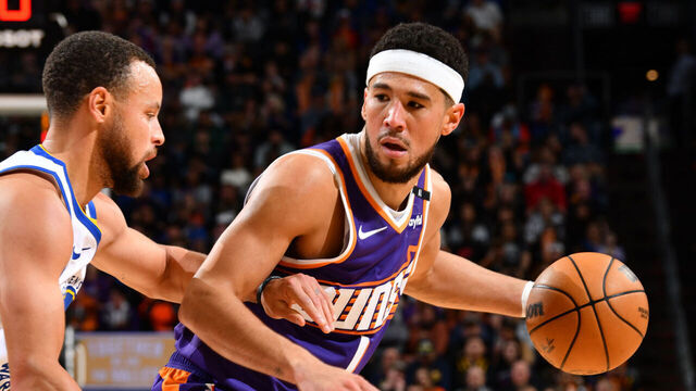 PHOENIX, AZ - NOVEMBER 30: Devin Booker #1 of the Phoenix Suns dribbles the ball during the game against the Golden State Warriors on November 30, 2024 at Footprint Center in Phoenix, Arizona. Mandatory Copyright Notice: Copyright 2024 NBAE