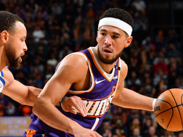 PHOENIX, AZ - NOVEMBER 30: Devin Booker #1 of the Phoenix Suns dribbles the ball during the game against the Golden State Warriors on November 30, 2024 at Footprint Center in Phoenix, Arizona. Mandatory Copyright Notice: Copyright 2024 NBAE