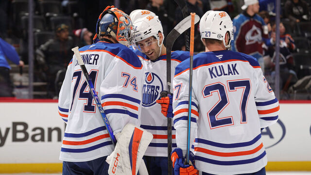 DENVER, COLORADO - NOVEMBER 30: Stuart Skinner #74, Evan Bouchard #2 and Brett Kulak #27 of the Edmonton Oilers celebrate a win against the Colorado Avalanche at Ball Arena on November 30, 2024 in Denver, Colorado.
