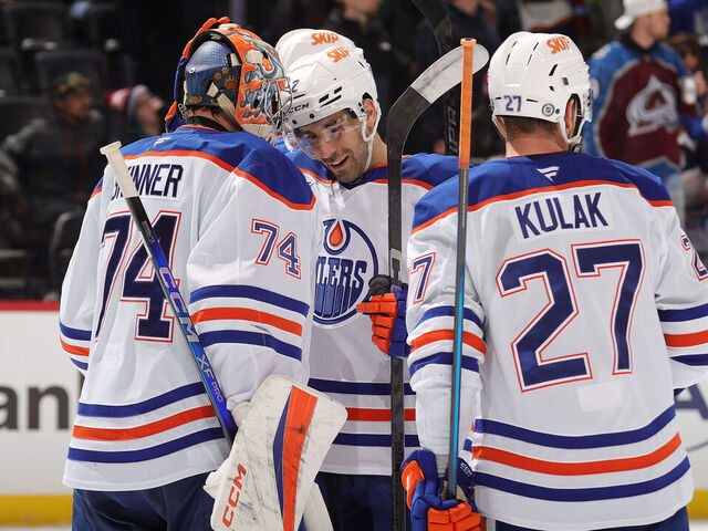 DENVER, COLORADO - NOVEMBER 30: Stuart Skinner #74, Evan Bouchard #2 and Brett Kulak #27 of the Edmonton Oilers celebrate a win against the Colorado Avalanche at Ball Arena on November 30, 2024 in Denver, Colorado.