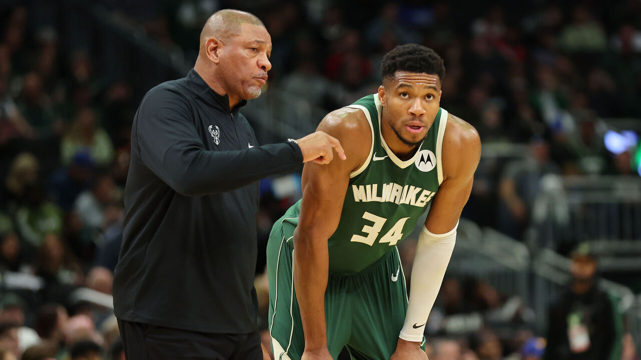 MILWAUKEE, WISCONSIN - OCTOBER 25: Giannis Antetokounmpo #34 of the Milwaukee Bucks speaks with head coach Doc Rivers during the second half of a game against the Chicago Bulls at Fiserv Forum on October 25, 2024 in Milwaukee, Wisconsin.