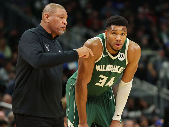 MILWAUKEE, WISCONSIN - OCTOBER 25: Giannis Antetokounmpo #34 of the Milwaukee Bucks speaks with head coach Doc Rivers during the second half of a game against the Chicago Bulls at Fiserv Forum on October 25, 2024 in Milwaukee, Wisconsin.