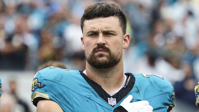 JACKSONVILLE, FLORIDA - OCTOBER 06: Walker Little #72 of the Jacksonville Jaguars looks on from the sideline during the national anthem prior to an NFL football game against the Indianapolis Colts at EverBank Stadium on October 6, 2024 in Jacksonville, Florida.