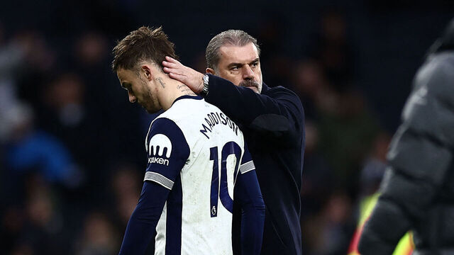 Tottenham Hotspur's Greek-Australian Head Coach Ange Postecoglou consoles Tottenham Hotspur's English midfielder #10 James Maddison on the pitch after the English Premier League football match between Tottenham Hotspur and Fulham at the Tottenham Hotspur Stadium in London, on December 1, 2024. The game finished 1-1.