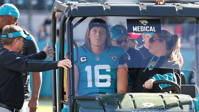 JACKSONVILLE, FLORIDA - DECEMBER 01: Quarterback Trevor Lawrence #16 of the Jacksonville Jaguars is taken off the field in a medical cart during the second quarter of a game against the Houston Texans at EverBank Stadium on December 01, 2024 in Jacksonville, Florida.