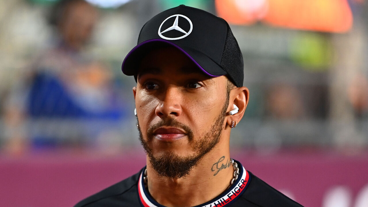 LUSAIL CITY, QATAR - NOVEMBER 30: Lewis Hamilton of Great Britain and Mercedes looks on from the grid prior to race one of F1 Academy Round 6 at Lusail International Circuit on November 30, 2024 in Lusail City, Qatar.