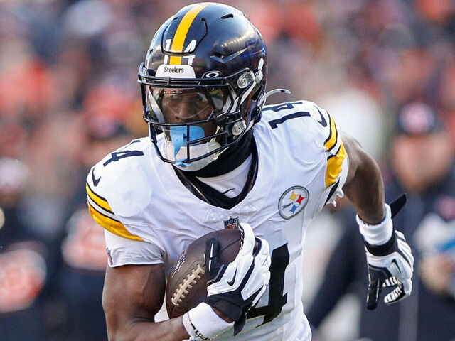 CINCINNATI, OH - DECEMBER 01: Pittsburgh Steelers wide receiver George Pickens (14) carries the ball during the game against the Pittsburgh Steelers and the Cincinnati Bengals on December 1, 2024, at Paycor Stadium in Cincinnati, OH.