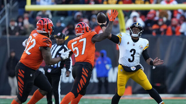 CINCINNATI, OHIO - DECEMBER 01: Russell Wilson #3 of the Pittsburgh Steelers throws a pass while pressured by Germaine Pratt #57 of the Cincinnati Bengals during the fourth quarter at Paycor Stadium on December 01, 2024 in Cincinnati, Ohio.