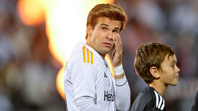 COMMERCE CITY, CO - NOVEMBER 01: Riqui Puig #10 of Los Angeles Galaxy walks onto the field as flames and sparks are lit before a first round match against the Colorado Rapids during the MLS Cup playoffs at Dick's Sporting Goods Park on November 1, 2024 in Commerce City, Colorado.