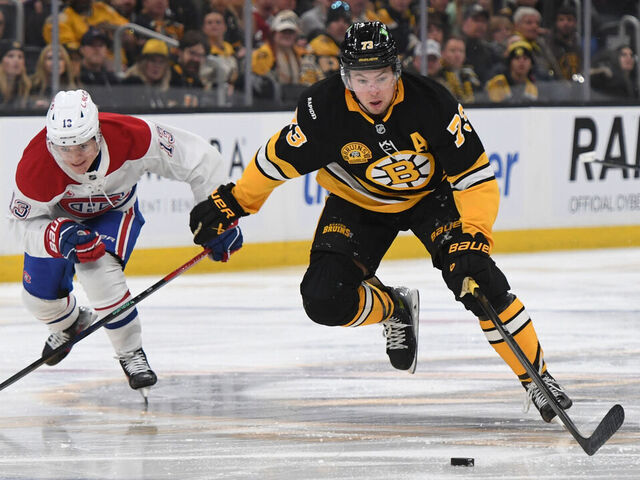 BOSTON, MASSACHUSETTS - DECEMBER 1: Charlie McAvoy #73 of the Boston Bruins skates with the puck against the Montreal Canadiens on December 1, 2024, at the TD Garden in Boston, Massachusetts.