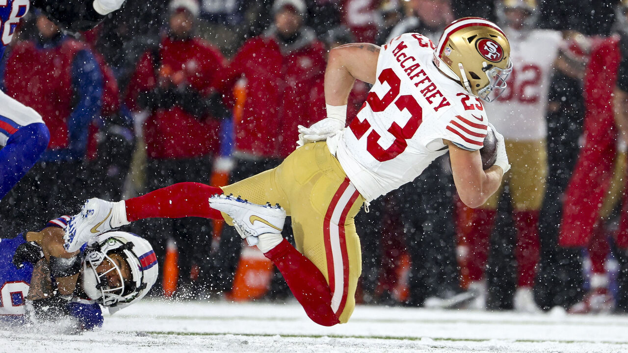 ORCHARD PARK, NEW YORK - DECEMBER 01: Christian McCaffrey #23 of the San Francisco 49ers is tackled by Taylor Rapp #9 of the Buffalo Bills in the second quarter of a game at Highmark Stadium on December 01, 2024 in Orchard Park, New York.