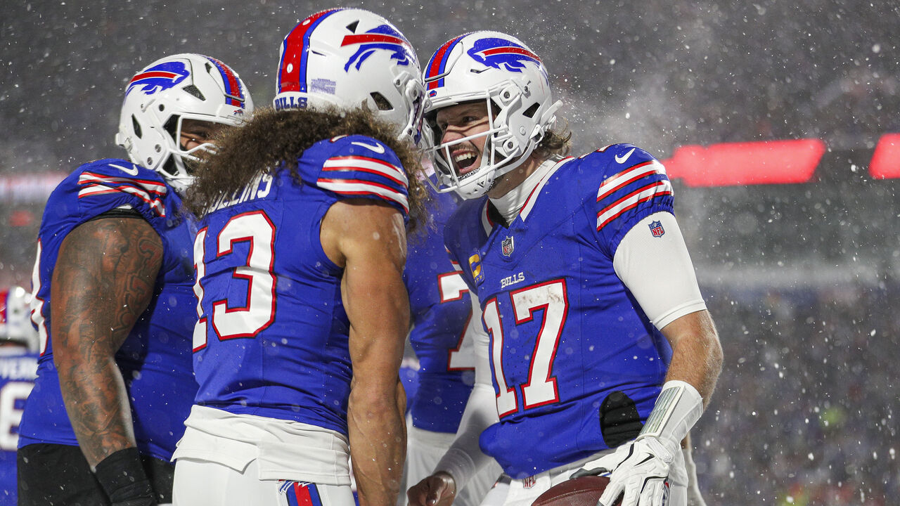 ORCHARD PARK, NEW YORK - DECEMBER 01: Josh Allen #17 of the Buffalo Bills celebrates with Mack Hollins #13 after a touchdown in the second quarter of a game against the San Francisco 49ers at Highmark Stadium on December 01, 2024 in Orchard Park, New York.
