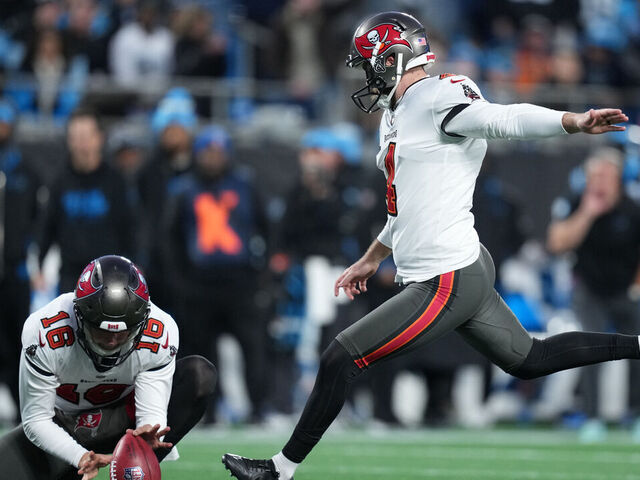 CHARLOTTE, NORTH CAROLINA - DECEMBER 01: Chase McLaughlin #4 of the Tampa Bay Buccaneers kicks a field goal during the second quarter against the Carolina Panthers at Bank of America Stadium on December 01, 2024 in Charlotte, North Carolina.