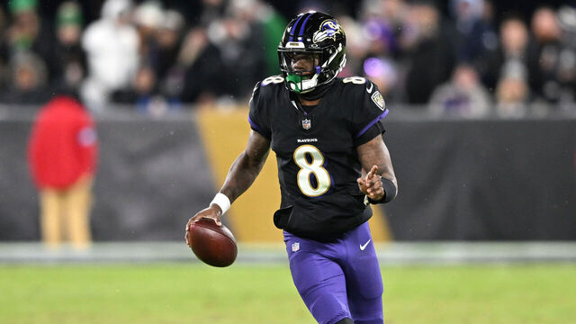 BALTIMORE, MARYLAND - DECEMBER 01: Lamar Jackson #8 of the Baltimore Ravens scrambles with the ball during the second quarter against the Philadelphia Eagles at M&T Bank Stadium on December 01, 2024 in Baltimore, Maryland.