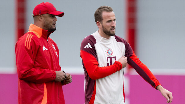 22 October 2024, Bavaria, Munich: Soccer: Champions League, FC Barcelona - Bayern Munich, preliminary round, matchday 3. FC Bayern's final training session at the Säbener Straße training ground. Harry Kane (r) and coach Vincent Kompany of Munich stand together. Photo: Sven Hoppe/dpa