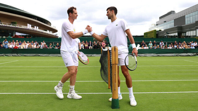 LONDON, ENGLAND - JULY 01: Andy Murray of Great Britain and Novak Djokovic of Serbia shake hands after a practice session ahead of The Championships - Wimbledon 2023 at All England Lawn Tennis and Croquet Club on July 01, 2023 in London, England.