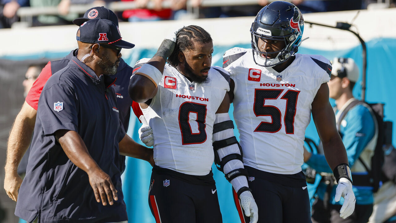 JACKSONVILLE, FL - DECEMBER 01: Houston Texans linebacker Azeez Al-Shaair (0) is escorted off the field by Houston Texans defensive end Will Anderson Jr. (51) after being ejected from the game between the Jacksonville Jaguars and the Houston Texans on December 1, 2024 at EverBank Stadium in Jacksonville, Fl.
