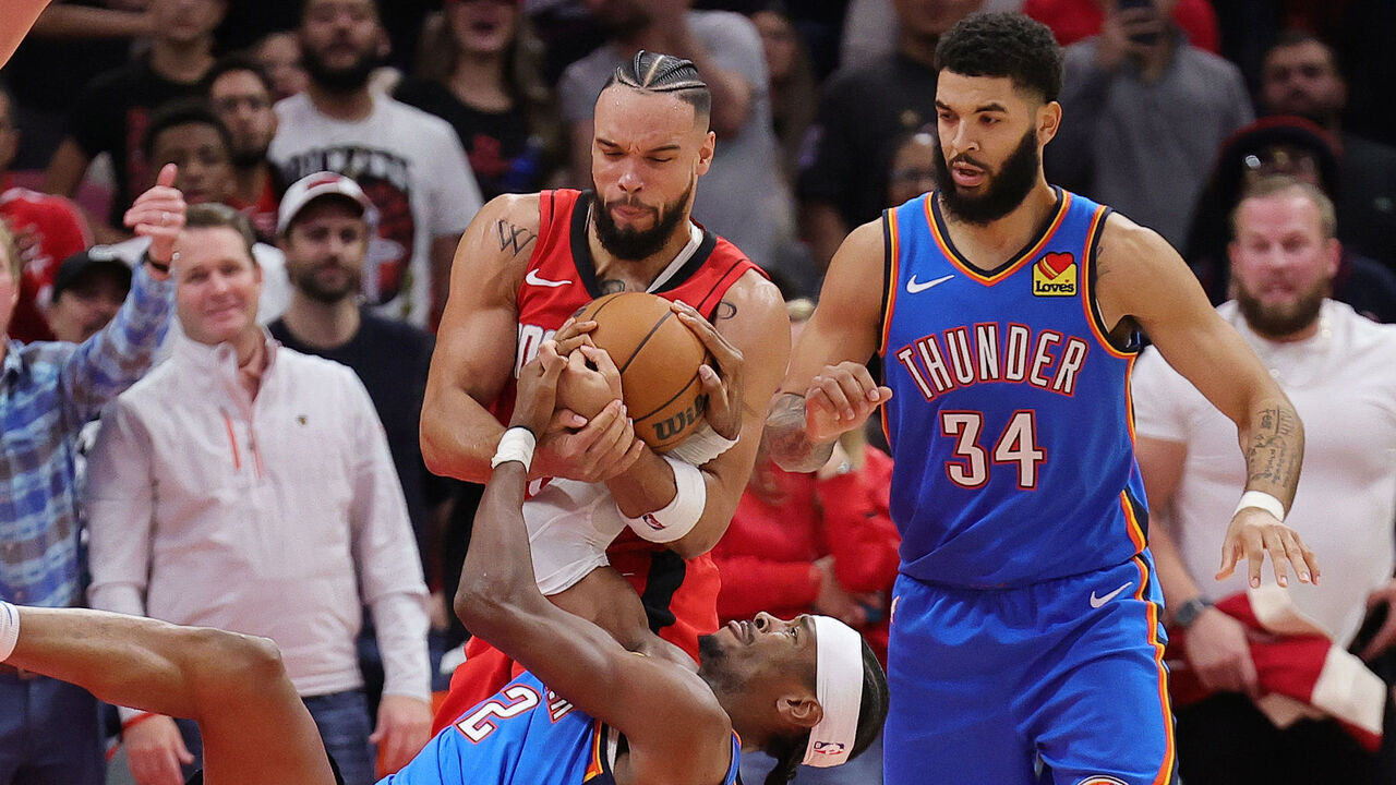 HOUSTON, TEXAS - DECEMBER 01: Dillon Brooks #9 of the Houston Rockets and Shai Gilgeous-Alexander #2 of the Oklahoma City Thunder battle for the ball during the second half at Toyota Center on December 01, 2024 in Houston, Texas.