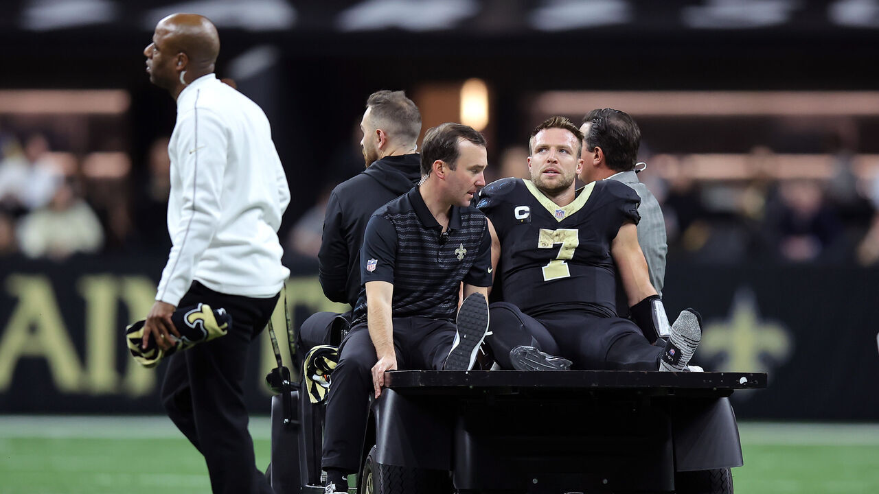 NEW ORLEANS, LOUISIANA - DECEMBER 01: Taysom Hill #7 of the New Orleans Saints is carted off the field during the fourth quarter against the Los Angeles Rams at Caesars Superdome on December 01, 2024 in New Orleans, Louisiana.