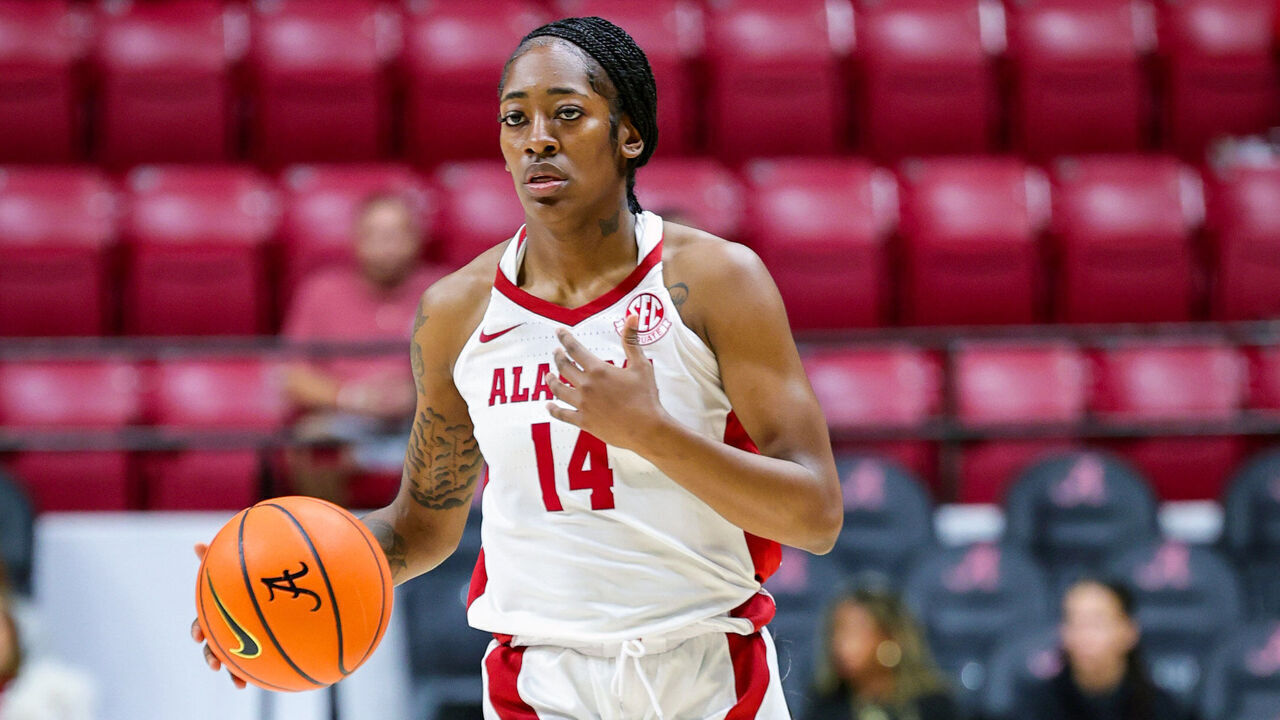 TUSCALOOSA, ALABAMA - NOVEMBER 10: Zaay Green #14 of the Alabama Crimson Tide brings the ball down court during the first half against the Troy Trojans at Coleman Coliseum on November 10, 2024 in Tuscaloosa, Alabama.