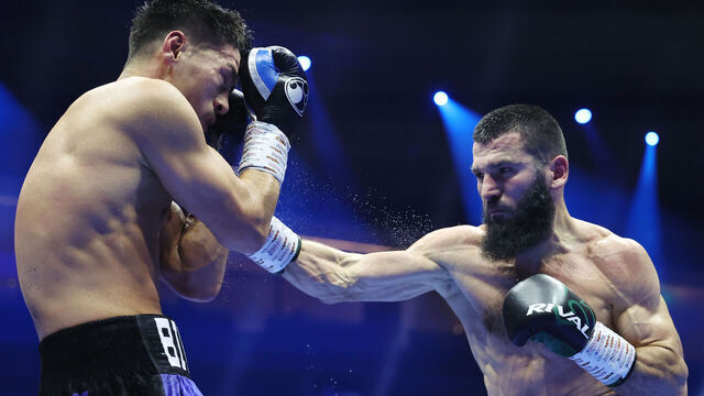 RIYADH, SAUDI ARABIA - OCTOBER 12: Artur Beterbiev punches Dmitrii Bivol during the IBF, IBO, WBC and WBO World Light Heavyweight titles' fight between Artur Beterbiev and Dmitrii Bivol as part of the Riyadh Season - IV Crown Showdown card at Kingdom Arena on October 12, 2024 in Riyadh.