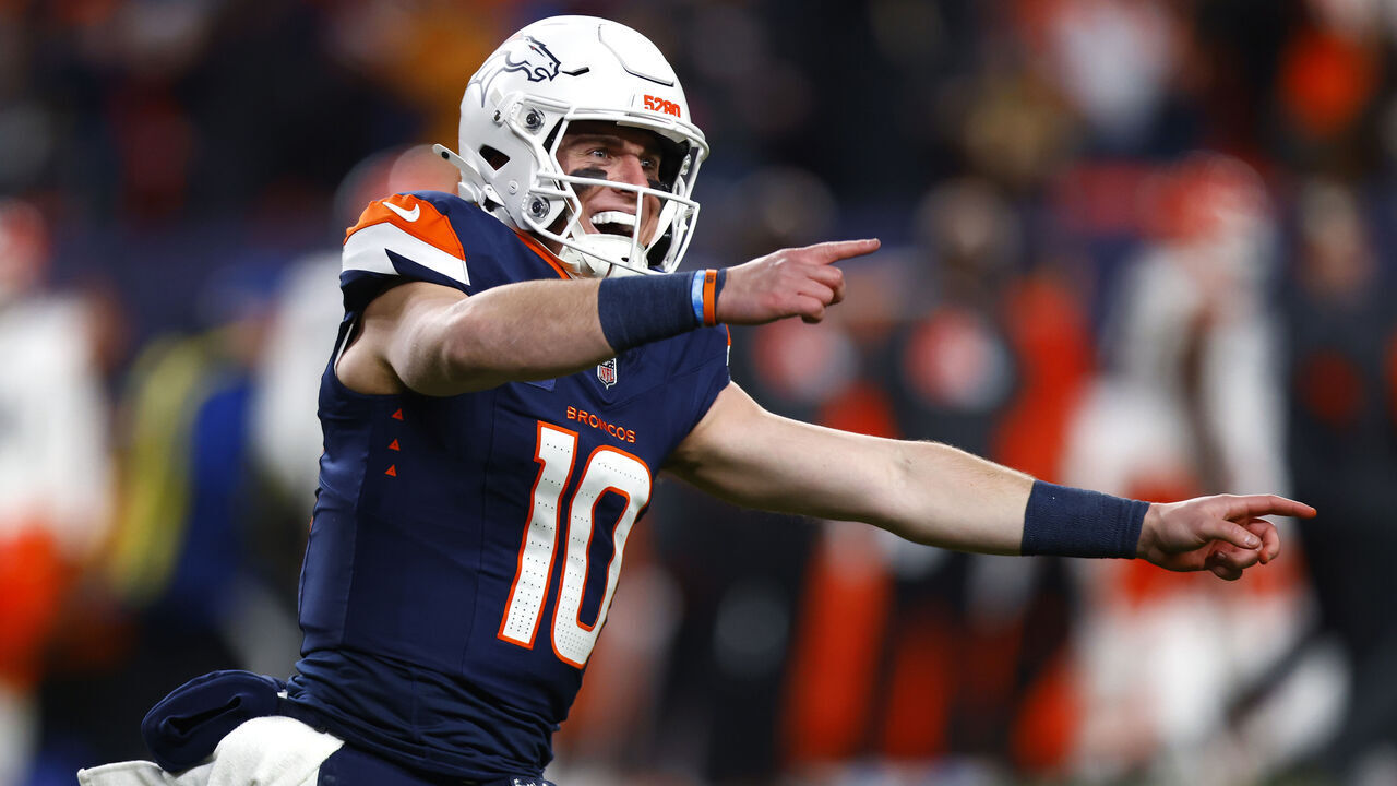 DENVER, COLORADO - DECEMBER 02: Bo Nix #10 of the Denver Broncos celebrates after throwing a 93 yard touchdown pass to Marvin Mims Jr. #19 against the Cleveland Browns during the third quarter in the game at Empower Field At Mile High on December 02, 2024 in Denver, Colorado.