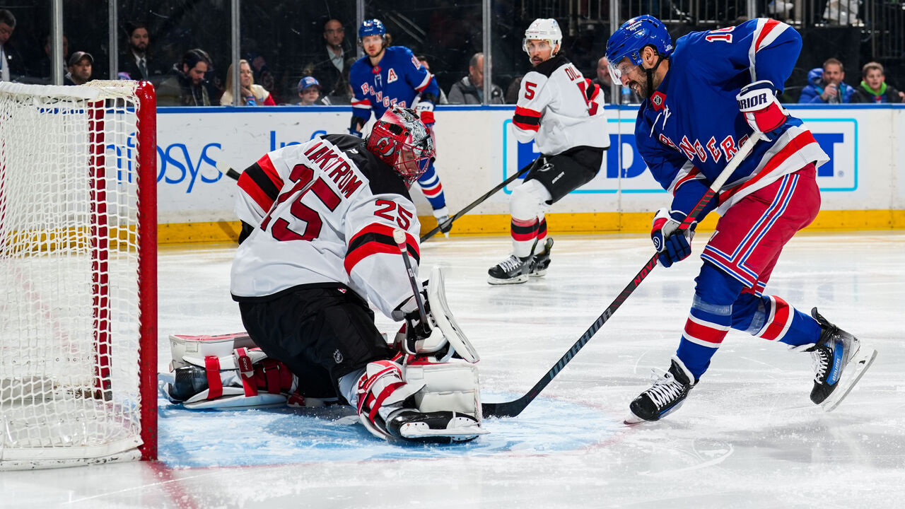 NEW YORK, NEW YORK - DECEMBER 02: Jacob Markstrom #25 of the New Jersey Devils makes a save against Vincent Trocheck #16 of the New York Rangers at Madison Square Garden on December 2, 2024 in New York City.