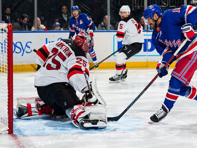 NEW YORK, NEW YORK - DECEMBER 02: Jacob Markstrom #25 of the New Jersey Devils makes a save against Vincent Trocheck #16 of the New York Rangers at Madison Square Garden on December 2, 2024 in New York City.
