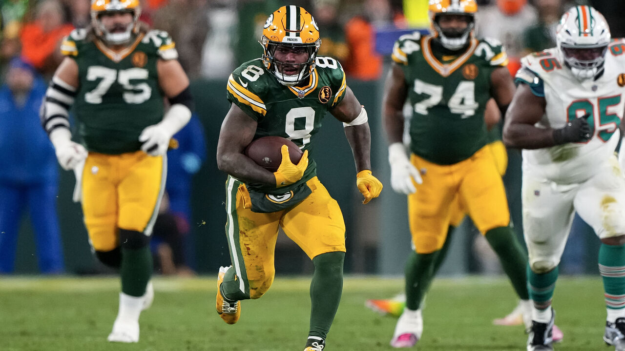 GREEN BAY, WISCONSIN - NOVEMBER 28: Running back Josh Jacobs #8 of the Green Bay Packers carries the ball during the second half of an NFL football game against the Miami Dolphins, at Lambeau Field on November 28, 2024 in Green Bay, Wisconsin.