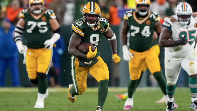 GREEN BAY, WISCONSIN - NOVEMBER 28: Running back Josh Jacobs #8 of the Green Bay Packers carries the ball during the second half of an NFL football game against the Miami Dolphins, at Lambeau Field on November 28, 2024 in Green Bay, Wisconsin.