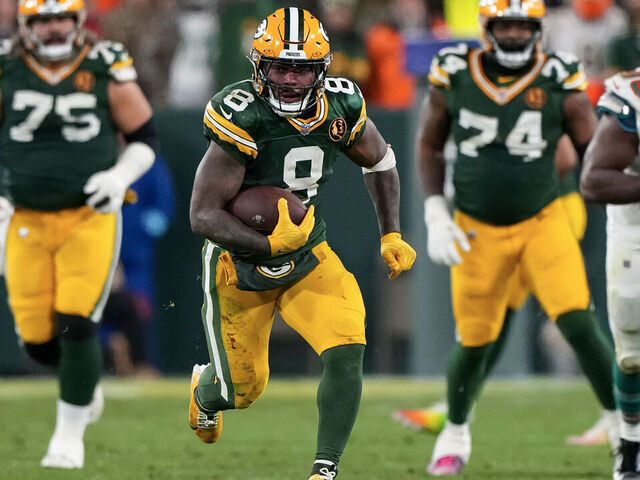 GREEN BAY, WISCONSIN - NOVEMBER 28: Running back Josh Jacobs #8 of the Green Bay Packers carries the ball during the second half of an NFL football game against the Miami Dolphins, at Lambeau Field on November 28, 2024 in Green Bay, Wisconsin.