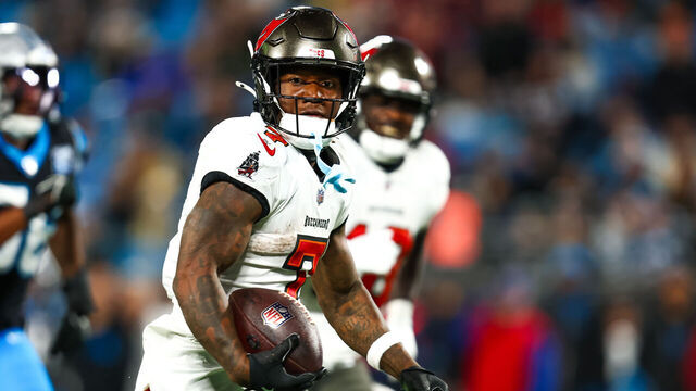 CHARLOTTE, NC - DECEMBER 01: Bucky Irving #7 of the Tampa Bay Buccaneers runs the ball during the second half of a football game against the Carolina Panthers at Bank of America Stadium on December 1, 2024 in Charlotte, North Carolina.