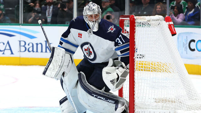DALLAS, TEXAS - DECEMBER 01: Connor Hellebuyck #37 of the Winnipeg Jets defends his net during the first period against the Dallas Stars at American Airlines Center on December 01, 2024 in Dallas, Texas.