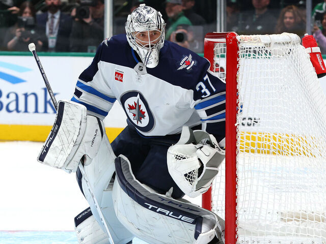 DALLAS, TEXAS - DECEMBER 01: Connor Hellebuyck #37 of the Winnipeg Jets defends his net during the first period against the Dallas Stars at American Airlines Center on December 01, 2024 in Dallas, Texas.