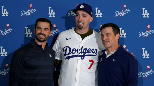 LOS ANGELES, CALIFORNIA - DECEMBER 03: Blake Snell poses for a picture with Dodgers executives Brandon Gomes and Andrew Friedman during a press conference introducing him as a Los Angeles Dodger at Dodger Stadium on December 03, 2024 in Los Angeles, California.