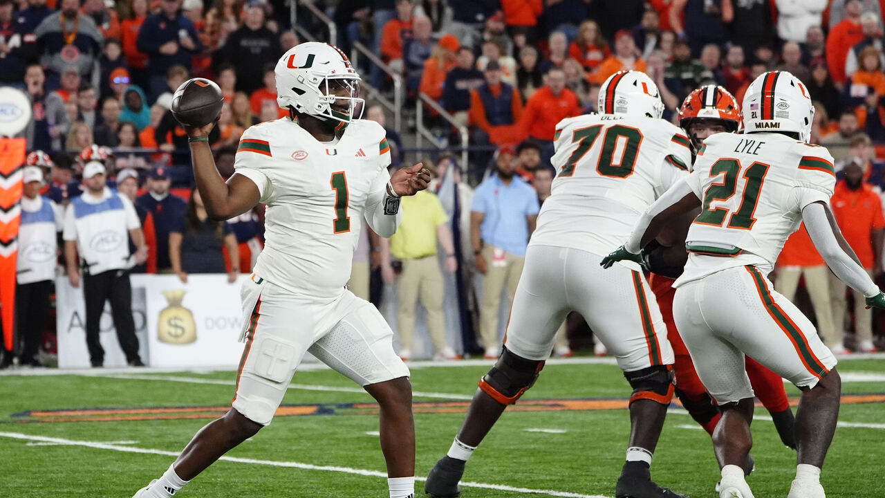 SYRACUSE, NY - NOVEMBER 30: Miami Hurricanes Quarterback Cam Ward (1) throws the ball during the second half of the College Football game between the Miami Hurricanes and the Syracuse Orange on November 30, 2024, at the JMA Wireless Dome in Syracuse, NY.