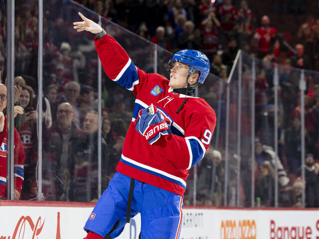 MONTREAL, CANADA- DECEMBER 3: Patrik Laine #92 of the Montreal Canadiens throws a puck in the crowd the fans after being named the first star of the NHL regular season game between the Montreal Canadiens and the New York Islanders at the Bell Centre on December 3, 2024 in Montreal, Quebec, Canada.