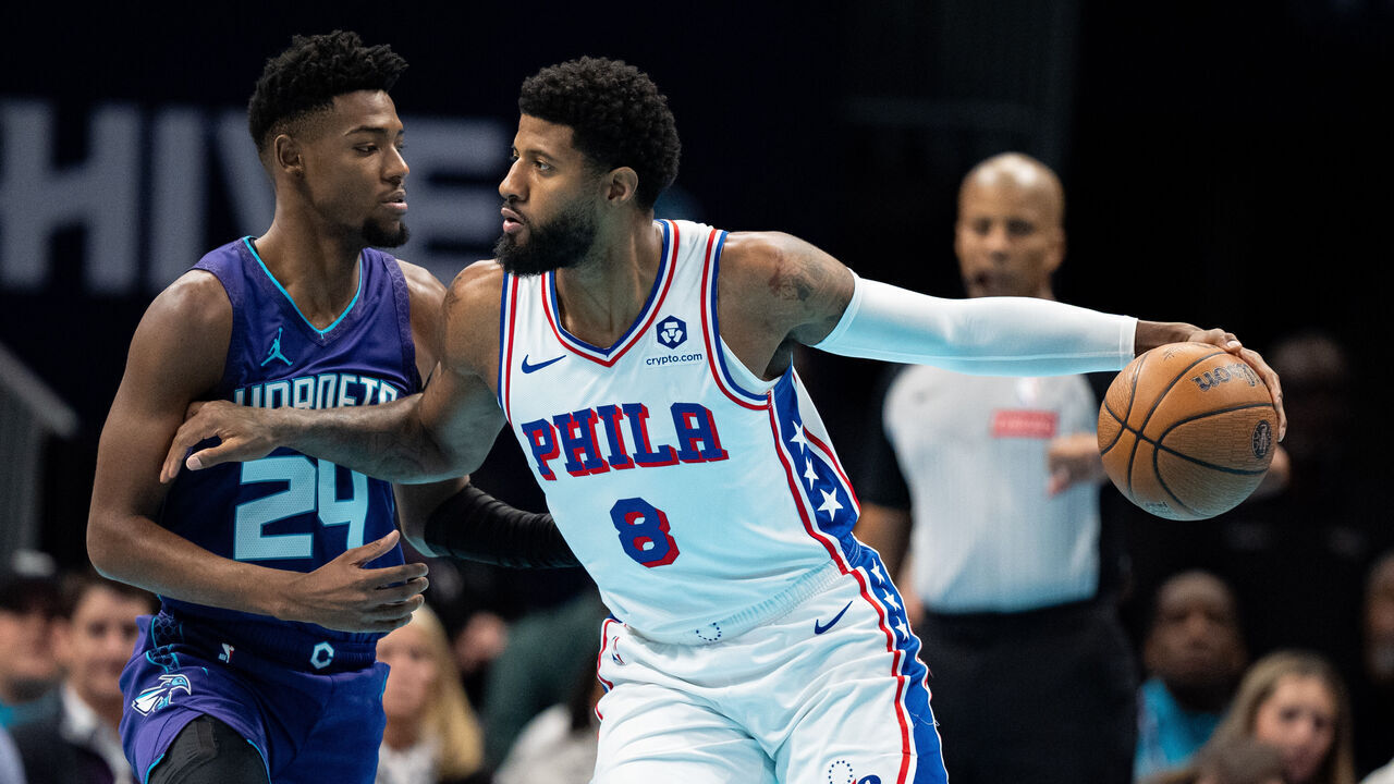 CHARLOTTE, NORTH CAROLINA - DECEMBER 03: Brandon Miller #24 of the Charlotte Hornets guards Paul George #8 of the Philadelphia 76ers in the first quarter of the game during the Emirates NBA Cup at Spectrum Center on December 03, 2024 in Charlotte, North Carolina.