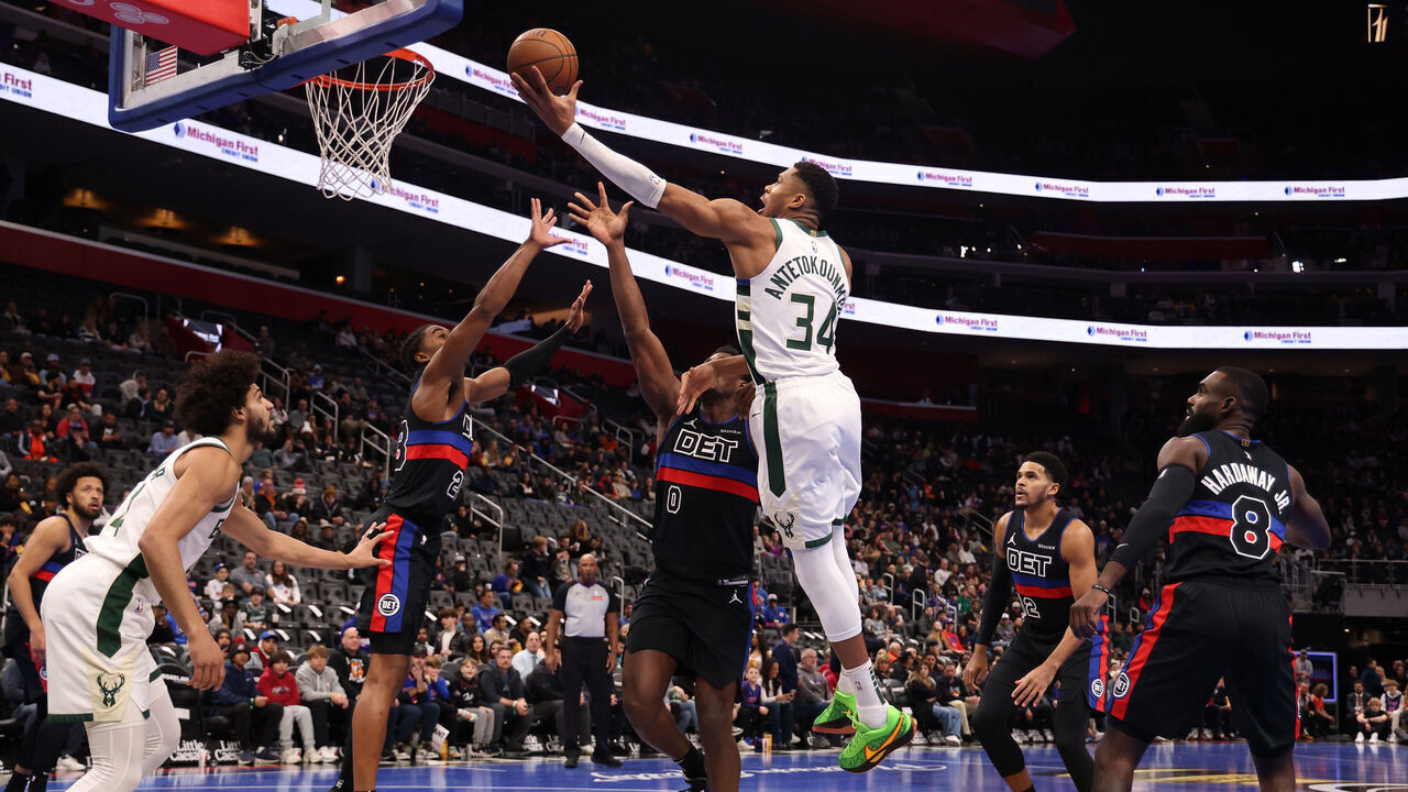 DETROIT, MICHIGAN - DECEMBER 03: Giannis Antetokounmpo #34 of the Milwaukee Bucks drives to the basket against Jalen Duren #0 of the Detroit Pistons during the first half of a NBA Cup game at Little Caesars Arena on December 03, 2024 in Detroit, Michigan. NOTE TO USER: User expressly acknowledges and agrees that, by downloading and or using this photograph, User is consenting to the terms and conditions of the Getty Images License.
