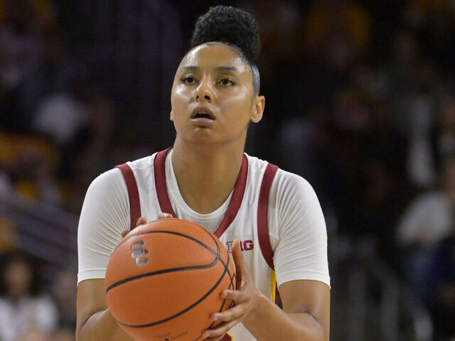 LOS ANGELES, CALIFORNIA - NOVEMBER 23: JuJu Watkins #12 of the USC Trojans handles the ball against the Notre Dame Fighting Irish at Galen Center on November 23, 2024 in Los Angeles, California.