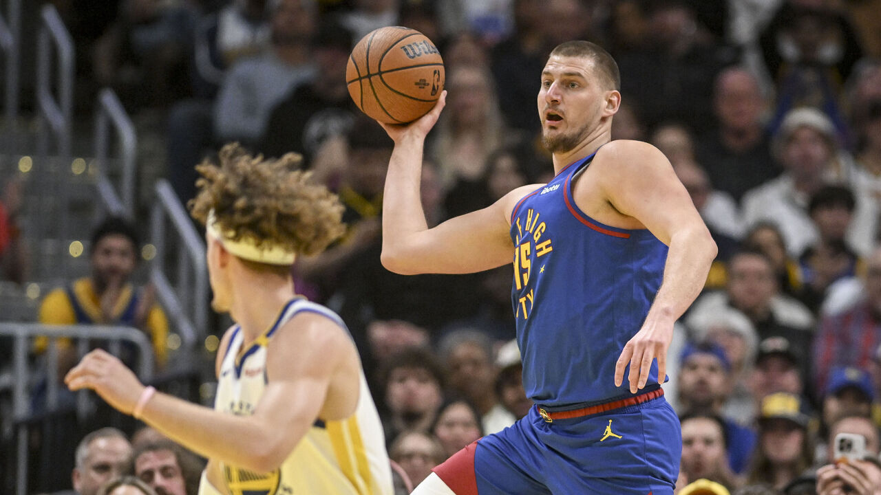 DENVER, CO - DECEMBER 3: Nikola Jokic (15) of the Denver Nuggets saves a loose ball against the Golden State Warriors during the first quarter at Ball Arena in Denver, Colorado on Tuesday, December 3, 2024.
