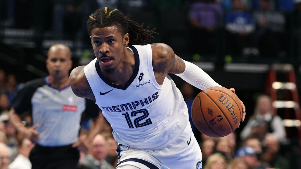DALLAS, TX - DECEMBER 3: Ja Morant #12 of the Memphis Grizzlies drives to the basket during the game against the Dallas Mavericks on December 3, 2024 at American Airlines Center in Dallas, Texas. Mandatory Copyright Notice: Copyright 2024 NBAE