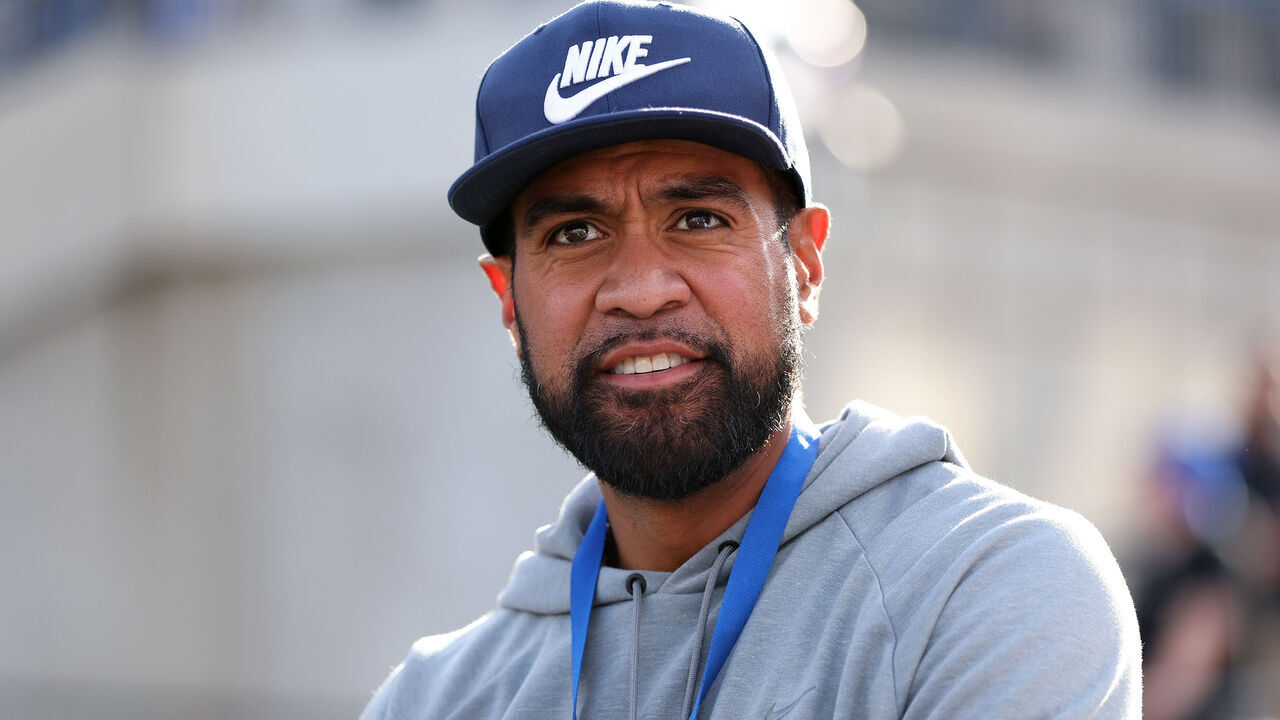 DALLAS, TEXAS - NOVEMBER 16: American golfer Tony Finau looks on during the first half of the game between the Southern Methodist Mustangs and the Boston College Eagles at Gerald J. Ford Stadium on November 16, 2024 in Dallas, Texas.